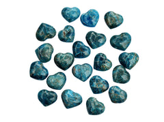 Several small blue apatite crystal hearts 30mm on white background