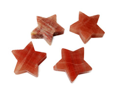 Four rose calcite stars on white background