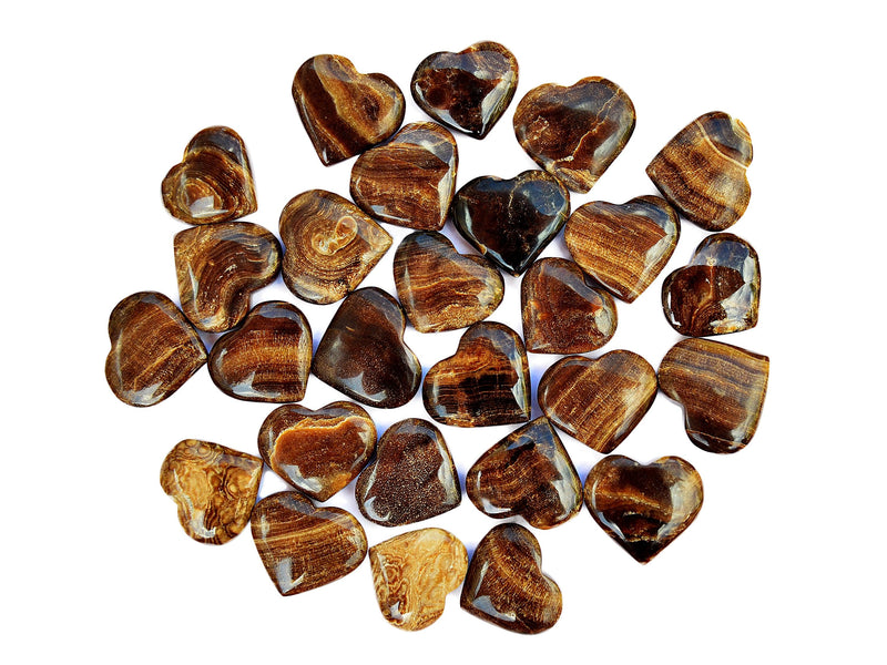 Several chocolate calcite small heart crystals 30mm-35mm on white background