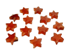 Several honey calcite star shapped crystals 55mm-60mm on white background