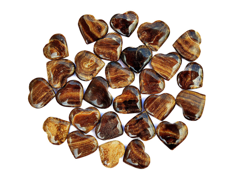 Several chocolate calcite small heart crystals 30mm-35mm on white background
