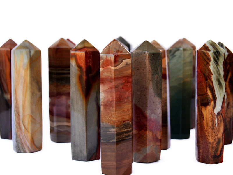 Several polychrome jasper towers 90mm on white background