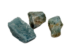 Three blue aquamarine raw specimens 30mm-90mm on white background