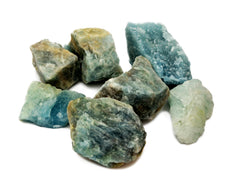 Seven blue aquamarine raw crystals 30mm-90mm on white background
