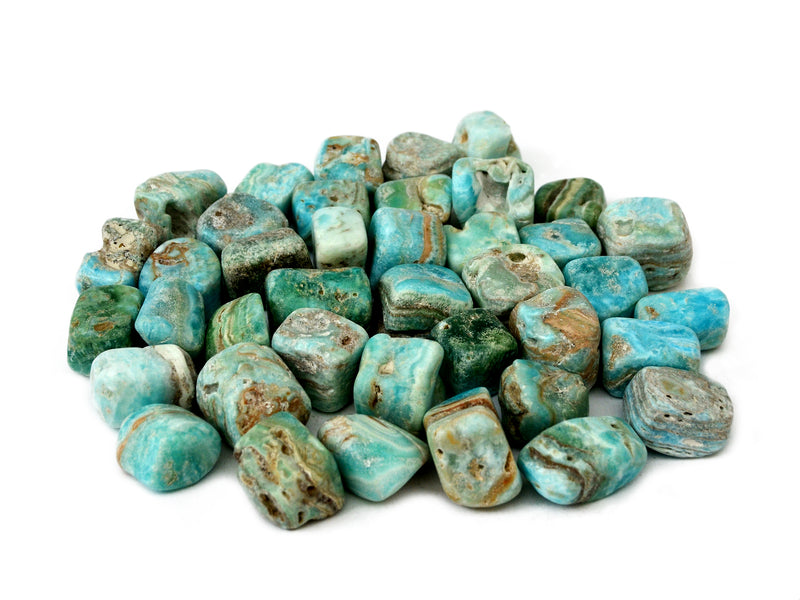 Several blue aragonite tumbled minerals on white background