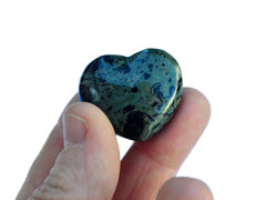 One mini kambaba jasper crystal hearts small 30mm on hand with white background
