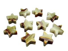 Several pink banded onyx star shapped crystals 55mm-60mm on white background