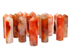 Several carnelian faceted point crystals on white background