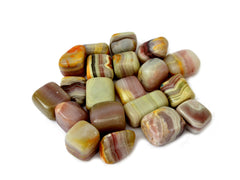 Some pink banded onyx tumbled stones 20mm-30mm on white background