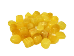 Several yellow calcite mini tumbled stones 20mm-30mm on white background