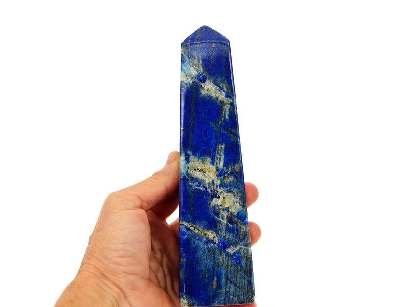 One large lapis lazuli obelisk 160mm on hand with white background