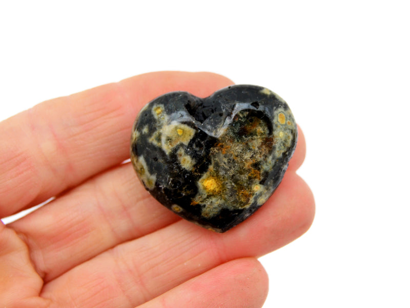 One ocean jasper small heart 35mm on hand with white background 