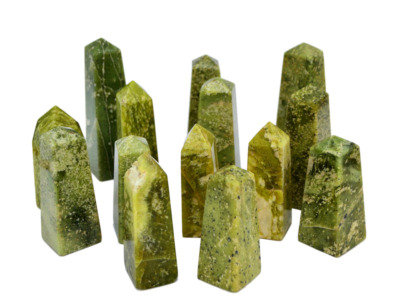 Some green serpentine obelisks stones 60mm-130mm on white background