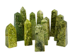 Several green serpentine obelisks crystals  60mm-130mm on white background