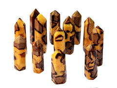 Several yellow septarian crystal points 90mm-140mm on white background