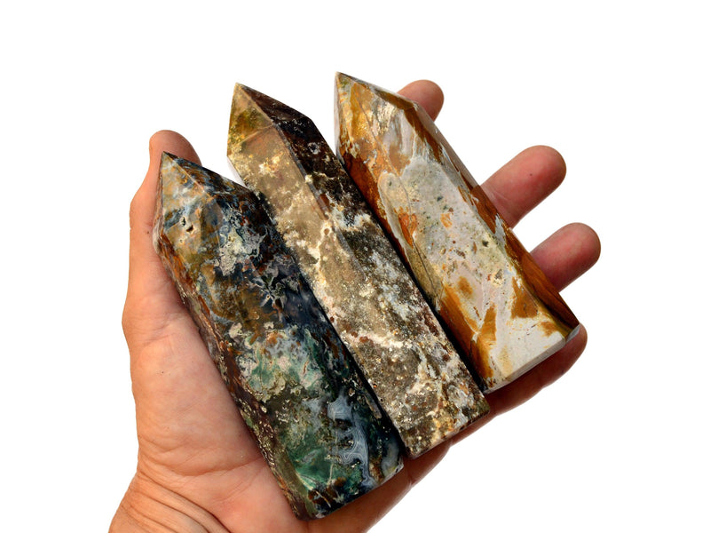 Three ocean jasper towers 120mm on hand with white background