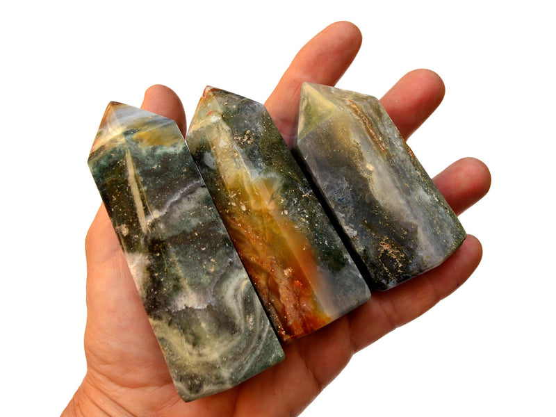 Three ocean jasper towers 70mm-120mm on hand with white background