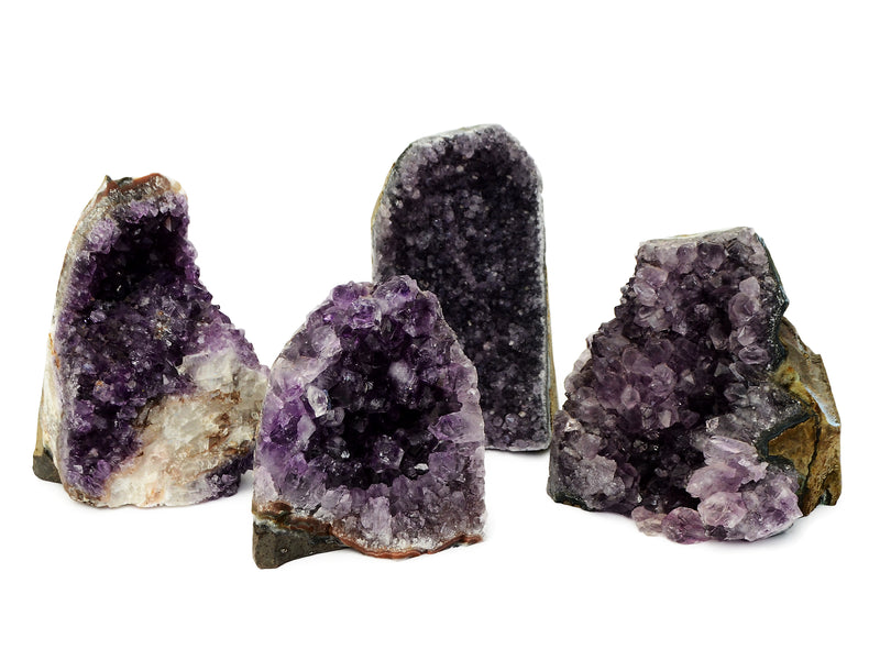 Four large druzy amethyst crystals cut base 98mm-122mm on white background
