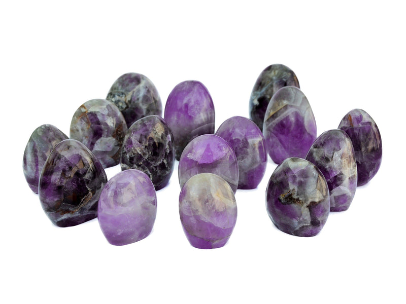 Several amethyst quartz free forms 55mm-100mm on white background