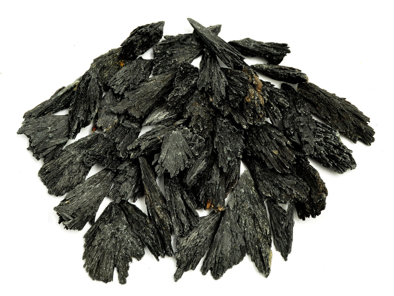 Several raw black kyanite crystals 30mm-100mm on white background