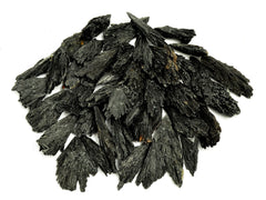 Several raw black kyanite crystals 30mm-100mm on white background
