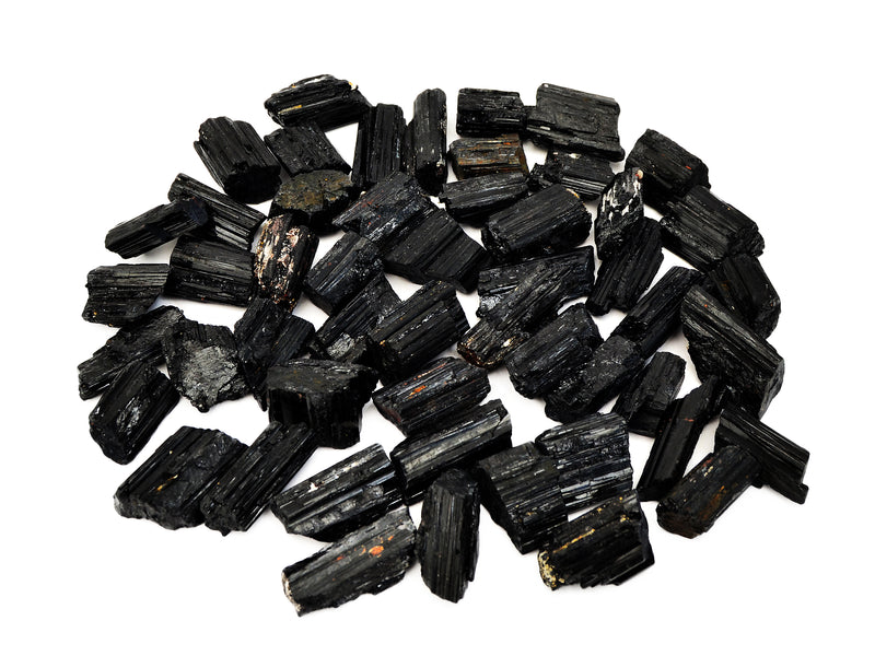Several raw black tourmaline stones 25mm-60mm on white background
