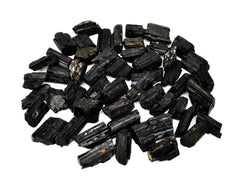 Several raw black tourmaline stones 25mm-60mm on white background