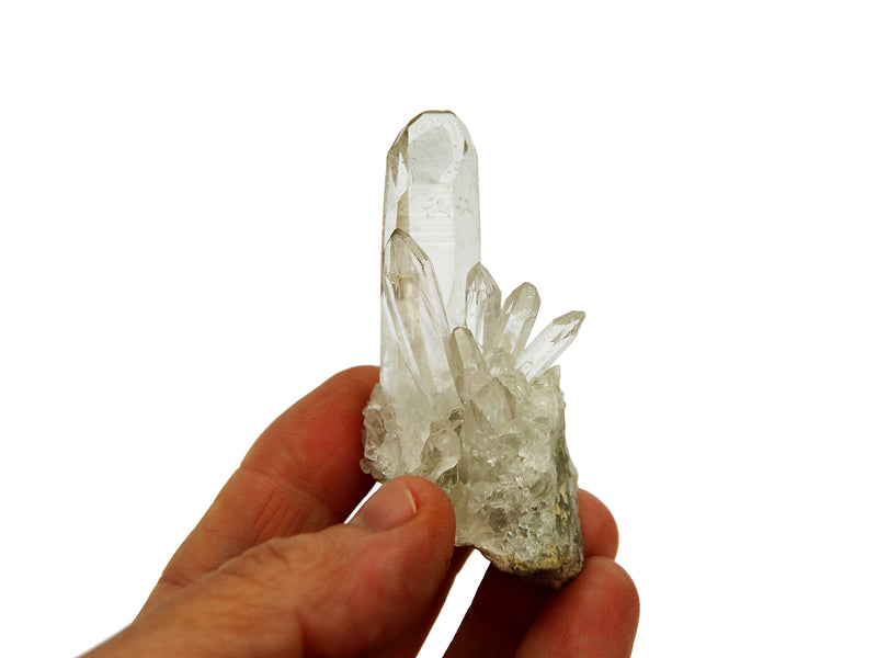 One mini clear quartz cluster 40mm on hand with white background
