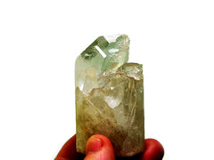 One druzy crystal quartz cylinder 60mm on hand with white background