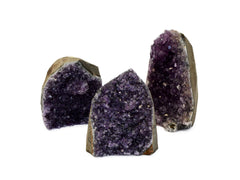 Three amethyst cut base stones 65mm-110mm on white background