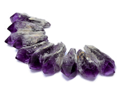 Some elestial amethyst raw points 60mm on white background