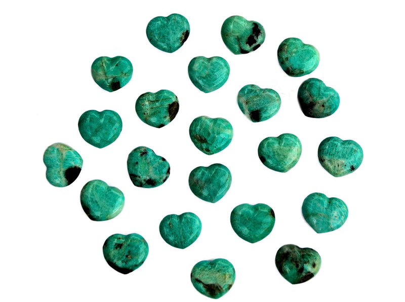 Several small green amazonite crystal hearts 30mm on white background