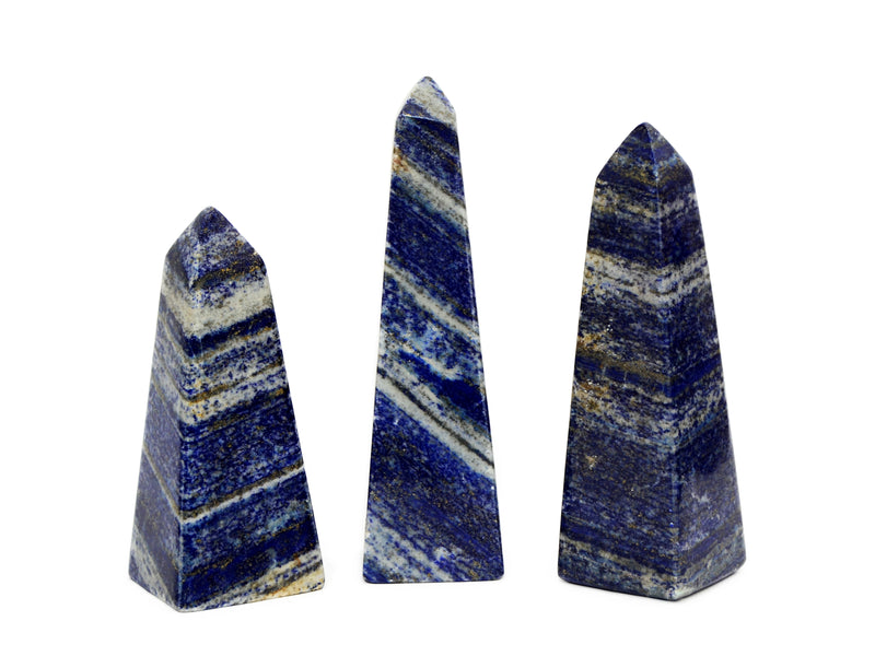 Three lapis lazuli obelisks 85mm-175mm on white background