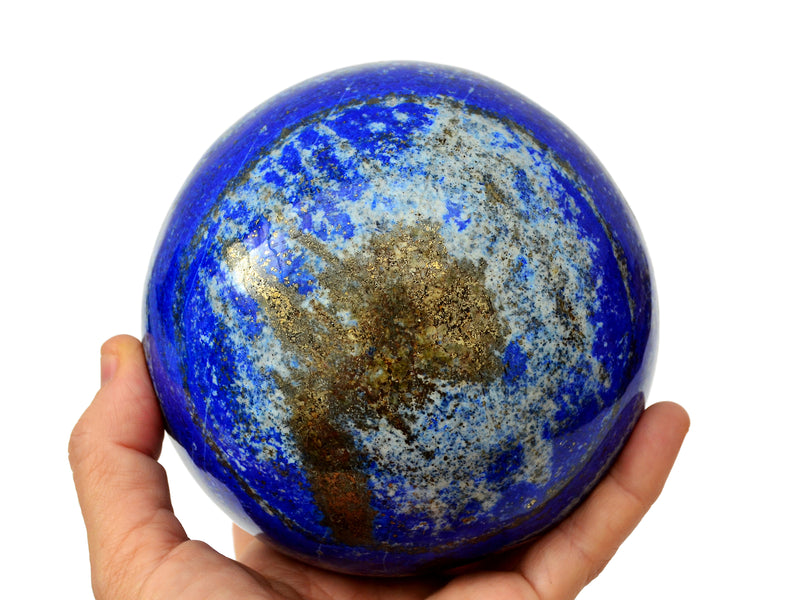 Extra large lapis lazuli sphere 120mm on hand with white background