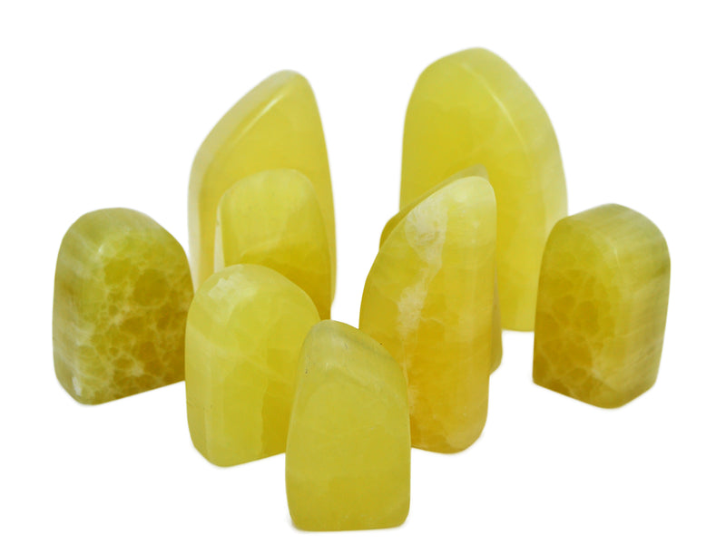 Some lemon calcite free form crystals 70mm-130mm on white background