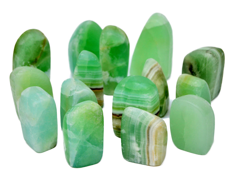 Several green pistachio calcite free forms 60mm-110mm on white background