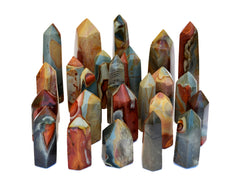 Several polychrome jasper crystal towers on white background