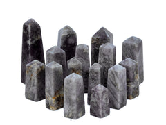 Several purple lepidolite crystal obelisks 40mm-105mm on white background