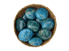 Several blue apatite palm stones 40mm-70mm inside a basket