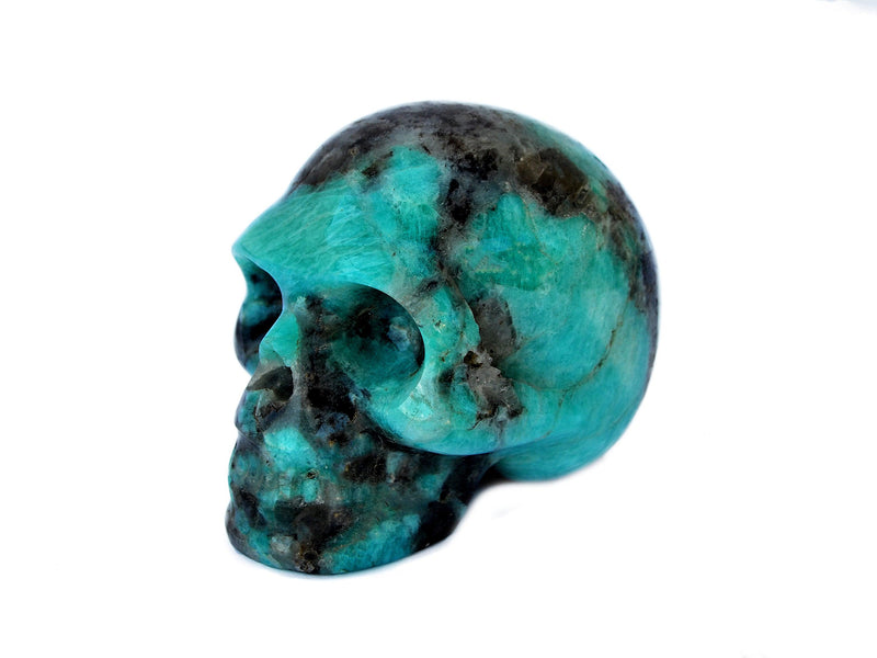 Green amazonite mineral skull carving 70mm on white background