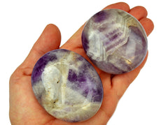 Two large pruple amethyst palm stones on hand
