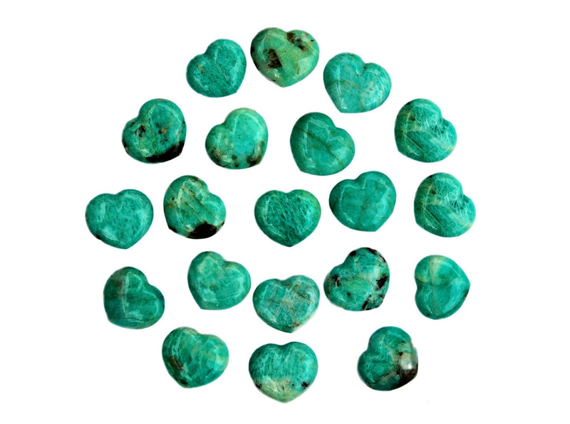 Several small amazonite crystal hearts 30mm forming a circle on white background