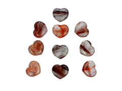 Some fire quartz puffy heart crystals 30mm on white background