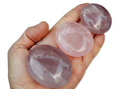 Three rose quartz palmstones 70mm-40mm on hand