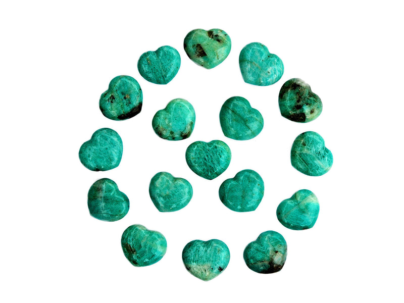 Several amazonite crystal hearts 30mm forming a circle on white background