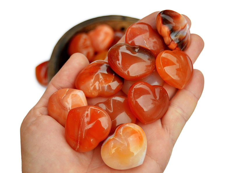 Some small carnelian crystal hearts 30mm on hand