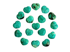 Several small green amazonite crystal hearts 30mm forming a circle on white background
