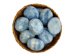 Several blue calcite palm stone crystals 40mm-70mm inside a basket