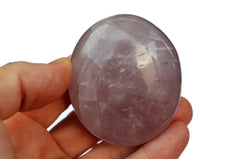 Large rose quartz palm stone 60mm on hand