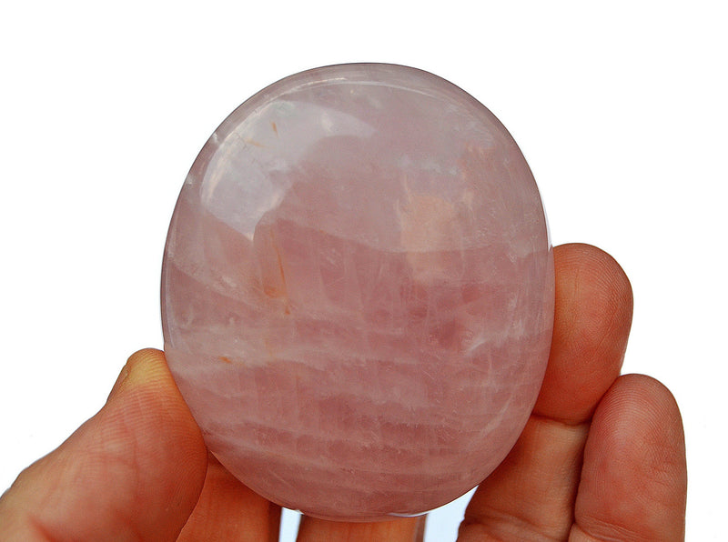 Rose quartz palm stone 70mm on hand